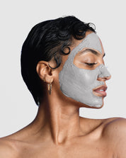 Skin care model with an activated charcoal mask facial on